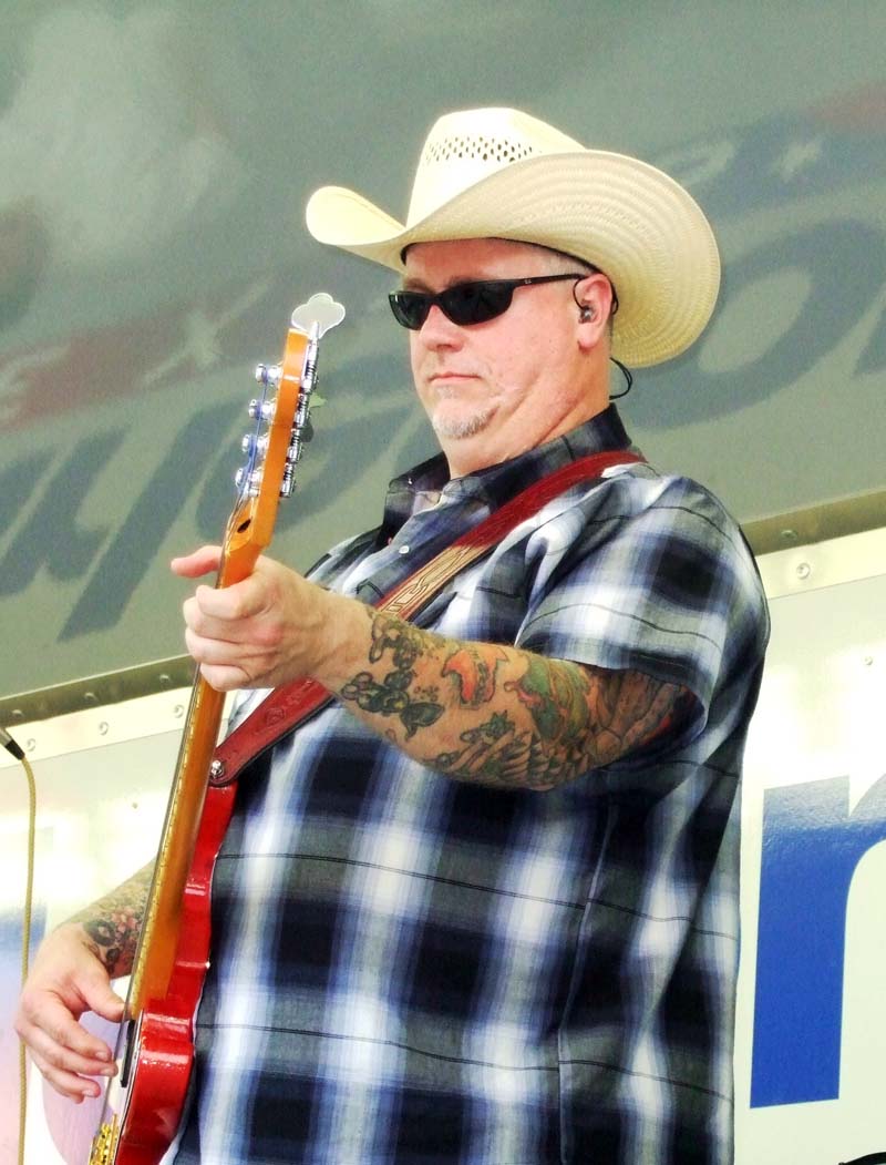 photo of man playing guitar